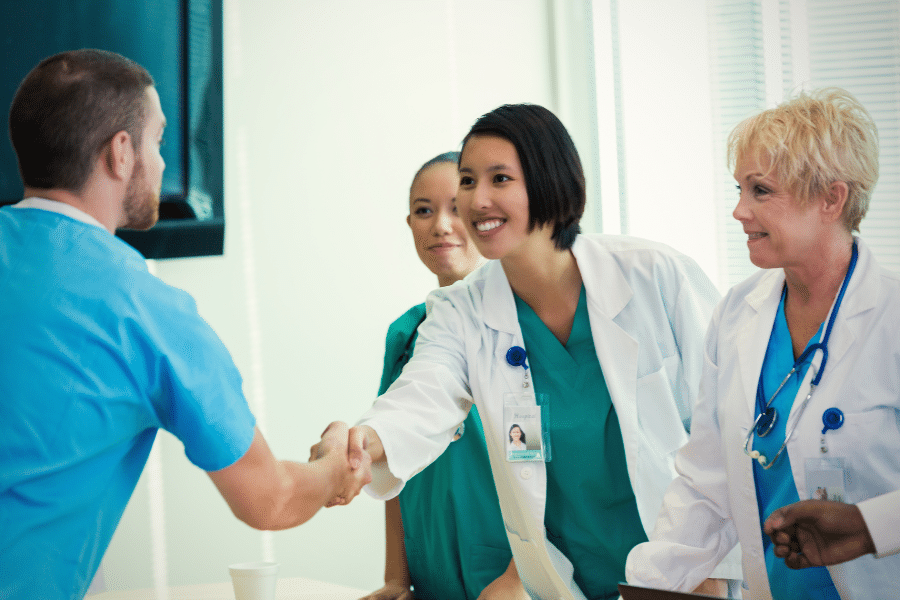Nurses shaking hands